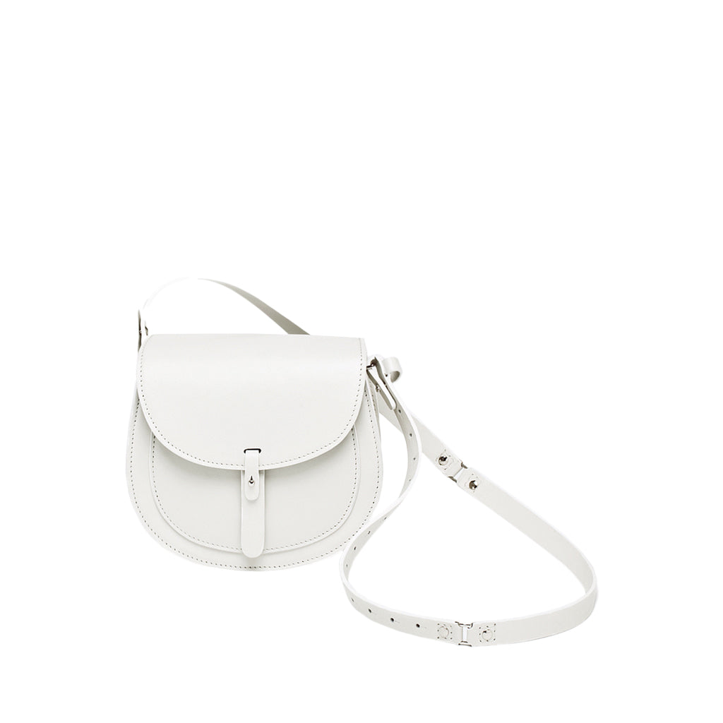 White leather crossbody saddle bag with adjustable strap