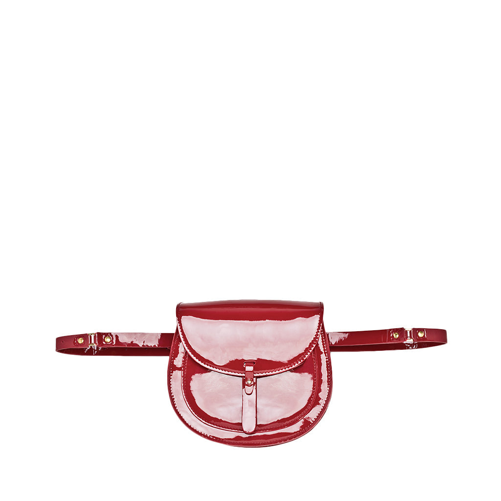 Red patent leather belt bag with adjustable strap and front flap