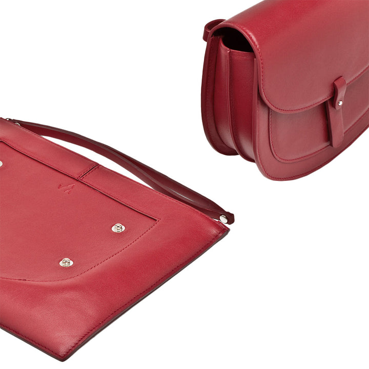 Elegant red leather shoulder bag and matching clutch with straps and metallic fastenings