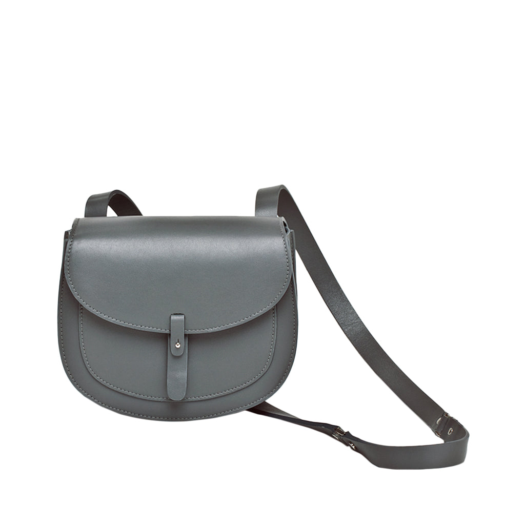 Gray leather crossbody saddle bag with adjustable strap