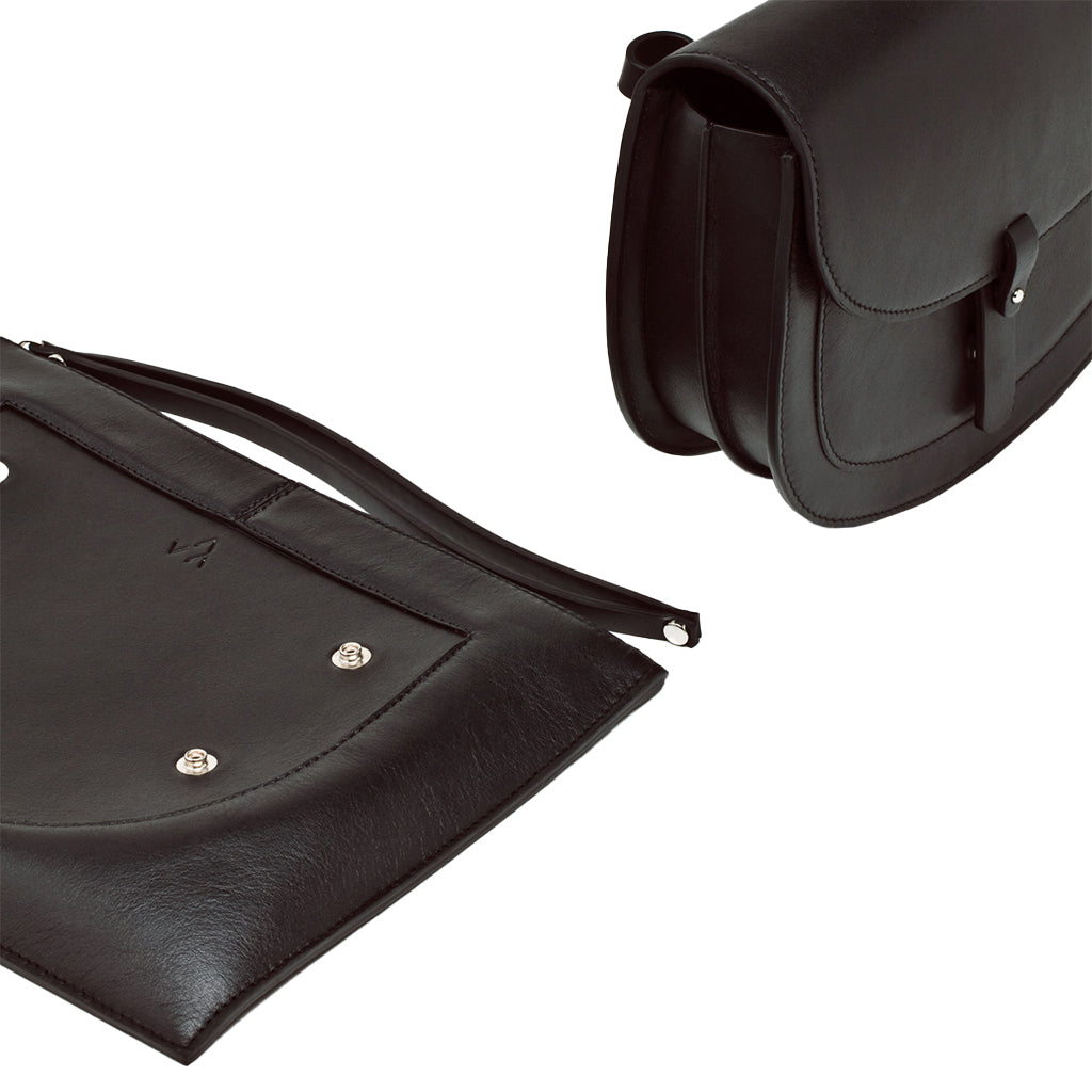 Black leather messenger and laptop bag with adjustable straps and silver accents