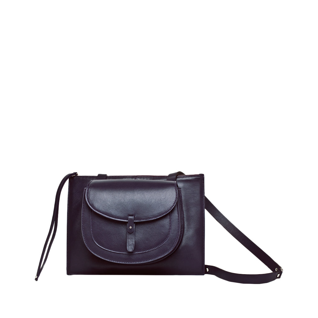 Elegant black leather handbag with a front pocket and adjustable strap
