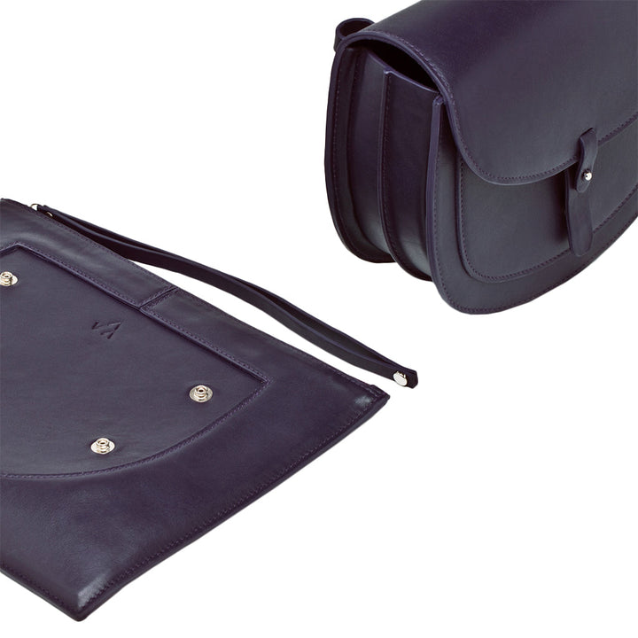 Elegant dark purple leather handbag and matching flat pouch displayed on white background