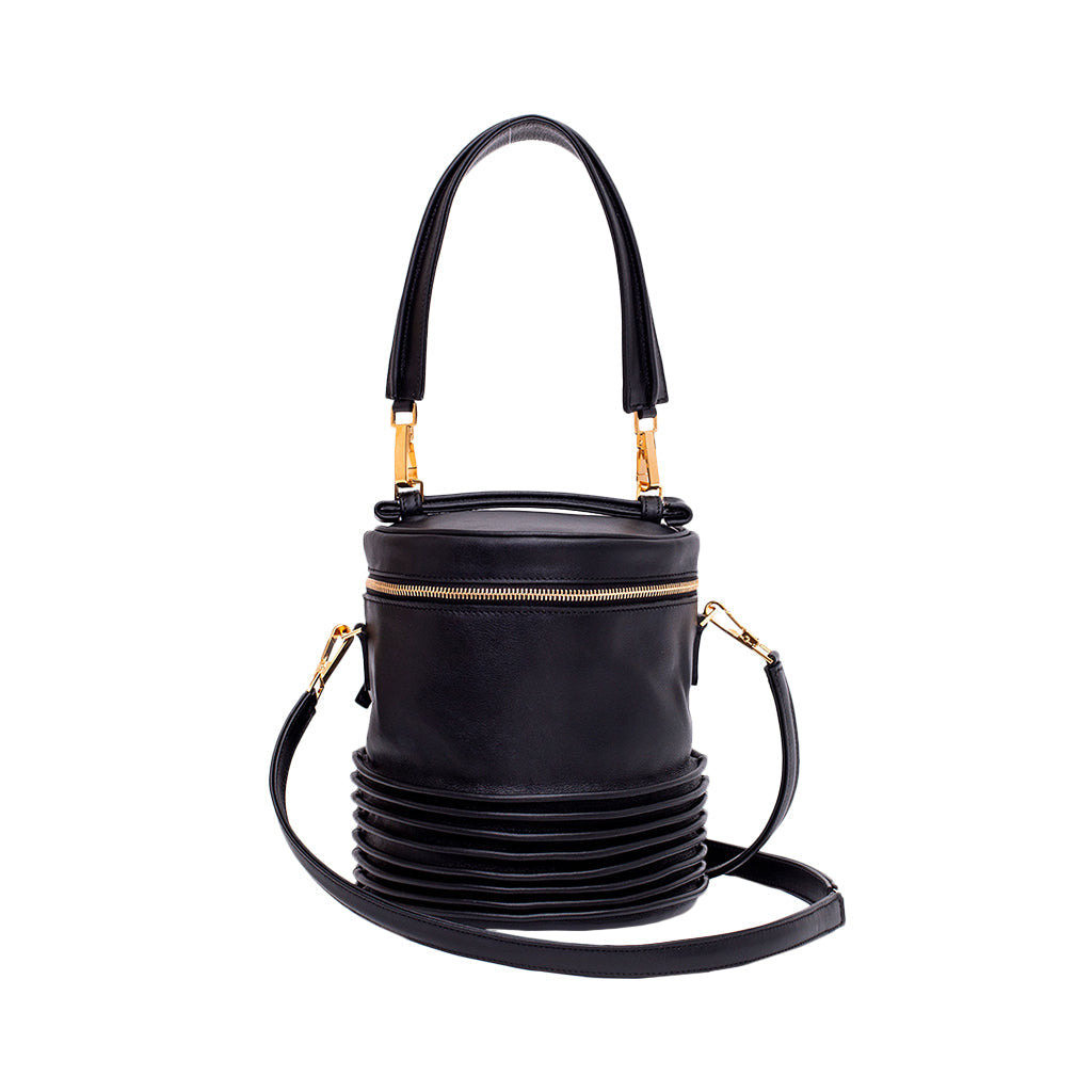 Sleek black leather bucket bag with gold zipper and detachable strap