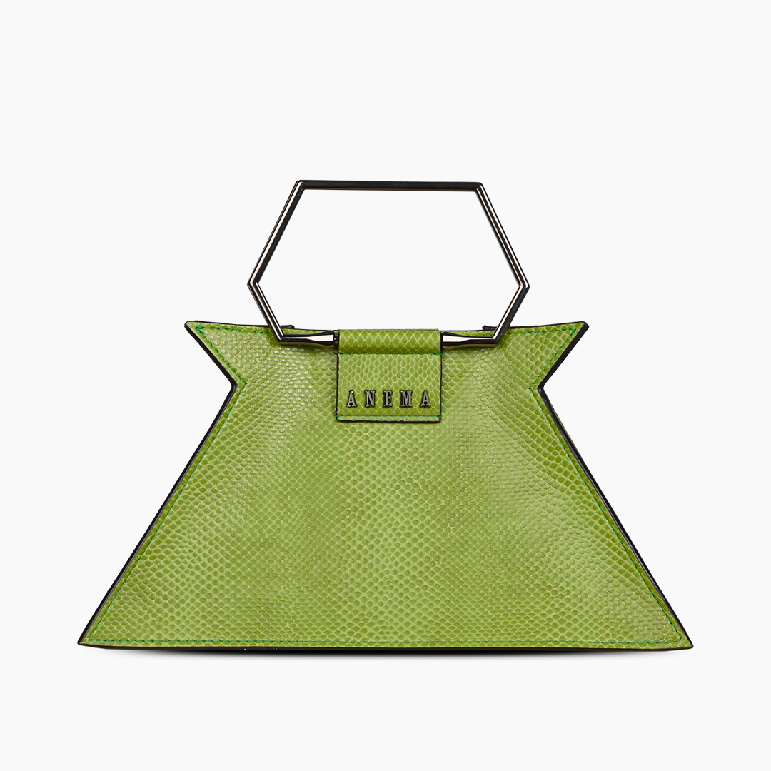 Green geometric designer handbag with metallic handle on white background