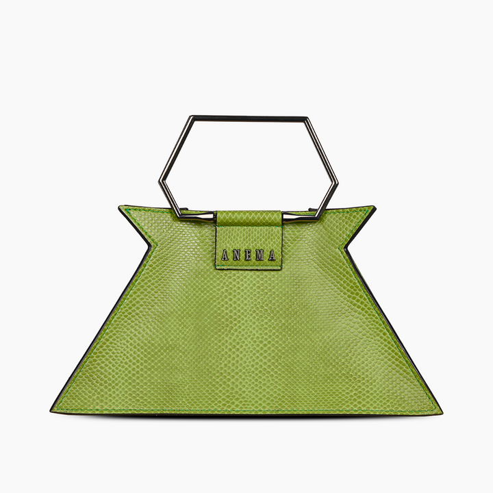 Green geometric designer handbag with metallic handle on white background