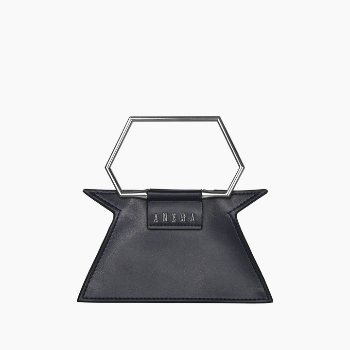 Black designer handbag with unique geometric metal handle