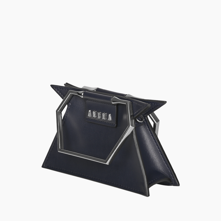 Navy blue geometric handbag with silver accents and unique hexagonal handle design