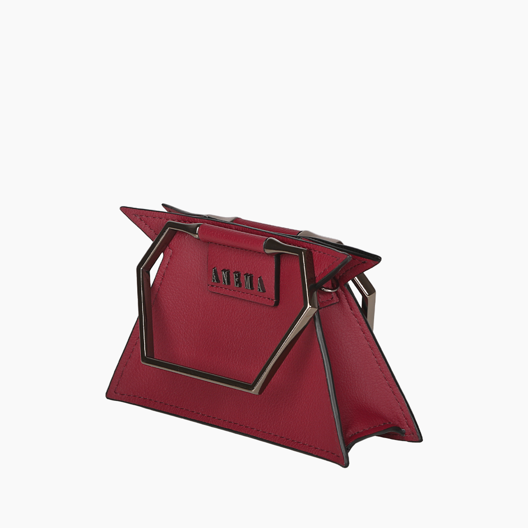 Trendy red leather handbag with geometric metal handle