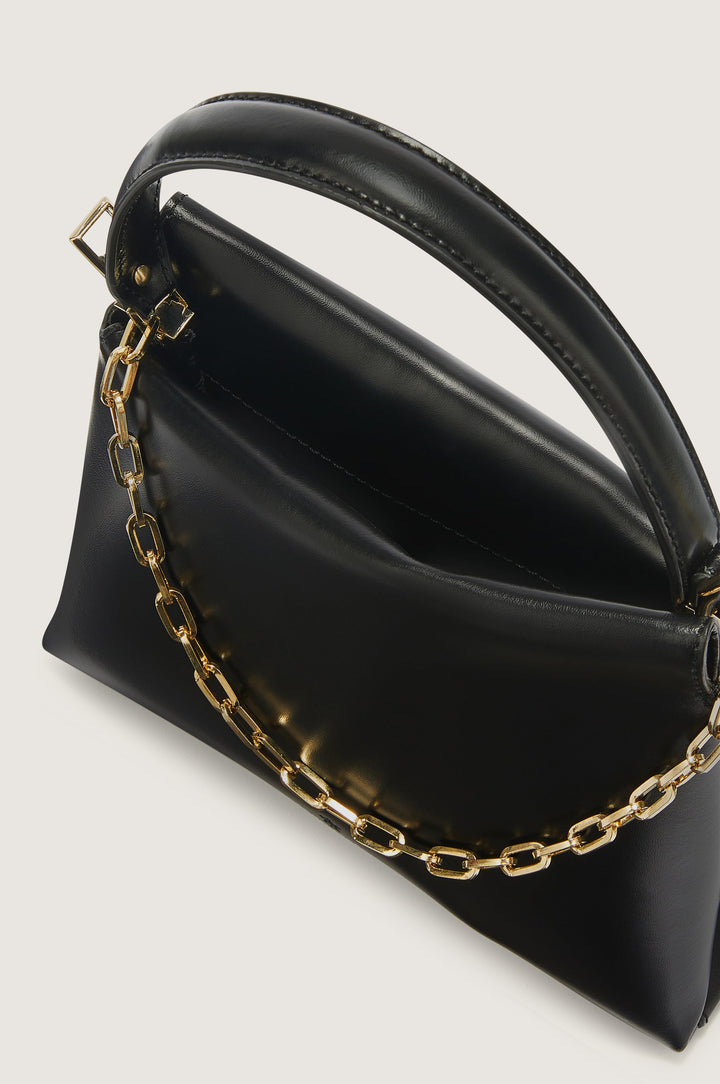 Black leather handbag with gold chain detail and handle