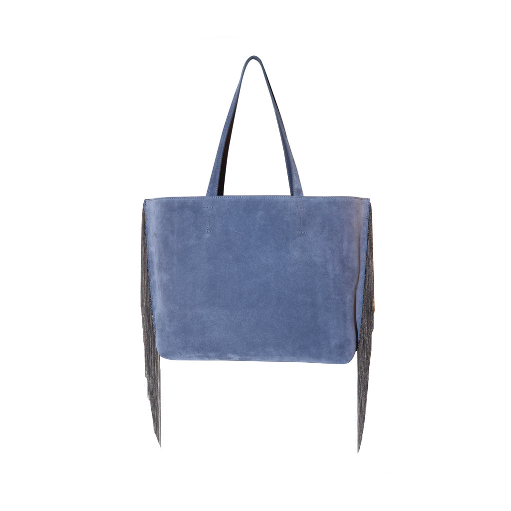 Blue suede tote bag with fringe detail and long handles on a white background