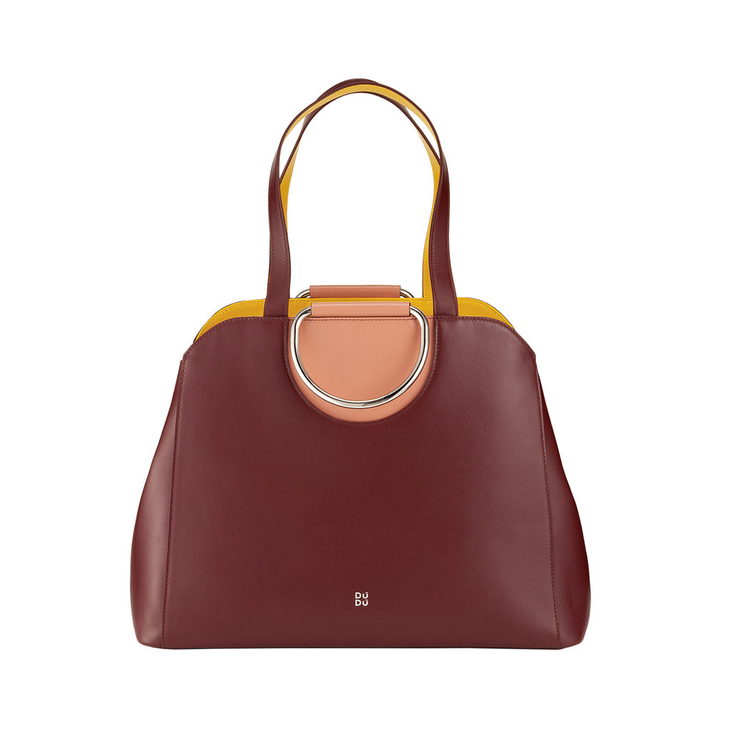 Burgundy leather handbag with gold and peach accents and top handles