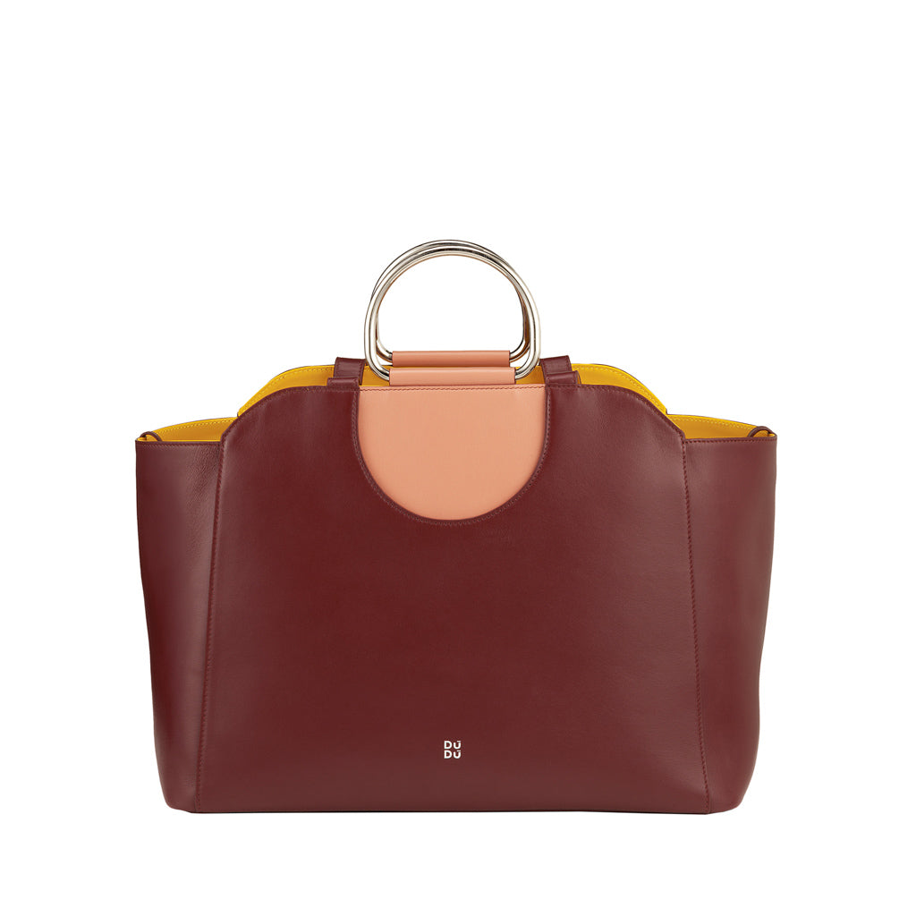 Luxury maroon leather handbag with dual metal handles and yellow interior