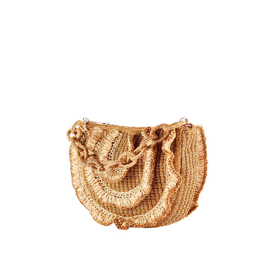 Handwoven straw handbag with braided handle on white background