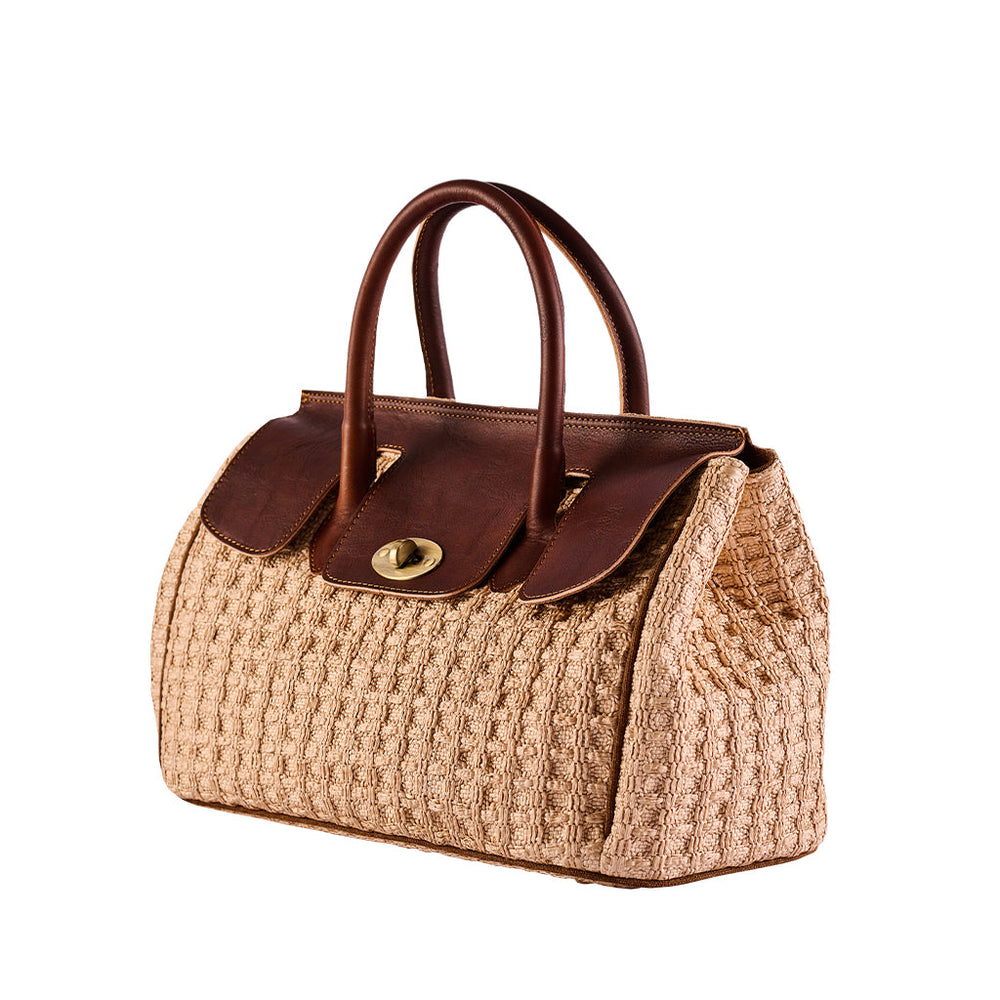 Tan and brown textured handbag with two handles and a flap closure