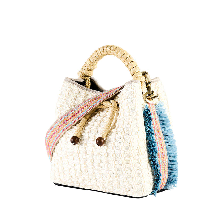 Woven white handbag with colorful strap and blue fringe detailing