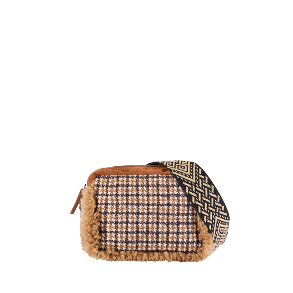 Stylish houndstooth patterned handbag with fur trim and black patterned strap