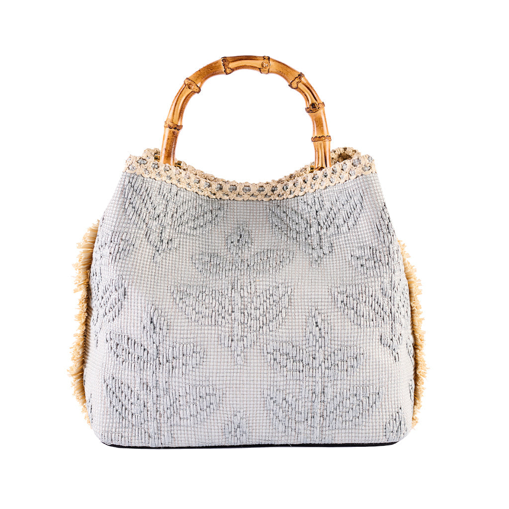 Handwoven gray handbag with bamboo handle and leaf pattern