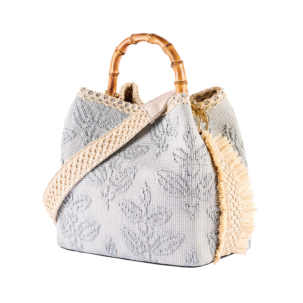Woven handbag with bamboo handle and gray leaf pattern