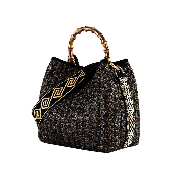 Stylish black handbag with bamboo handle and geometric patterned strap