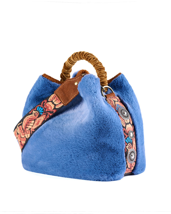 Blue faux fur handbag with woven floral strap and wooden handle