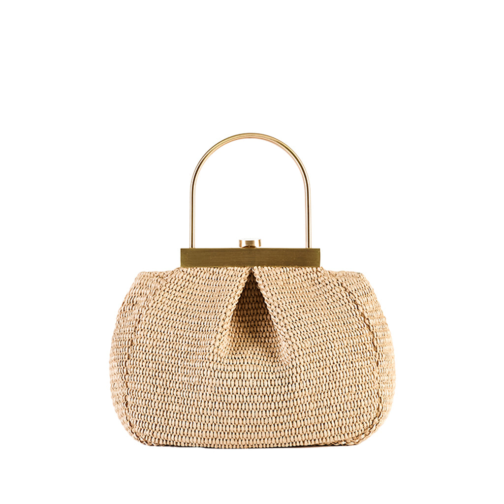 Straw handbag with gold handle and clasp against white background