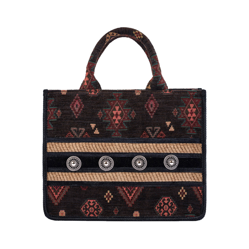 Handmade tribal pattern handbag with decorative elements and dual handles