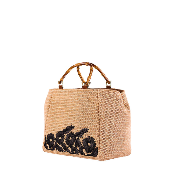 Elegant straw handbag with black floral embroidery and bamboo handles