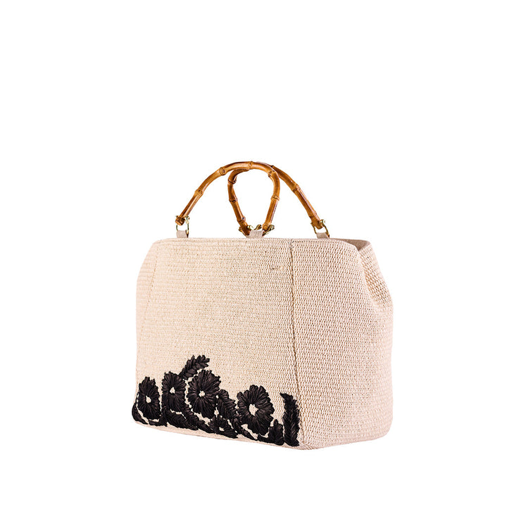 Beige handwoven bag with bamboo handles and black floral embroidery