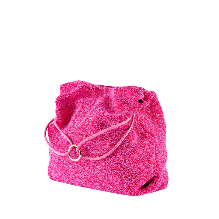 Bright pink drawstring handbag with textured fabric and circular metal accent