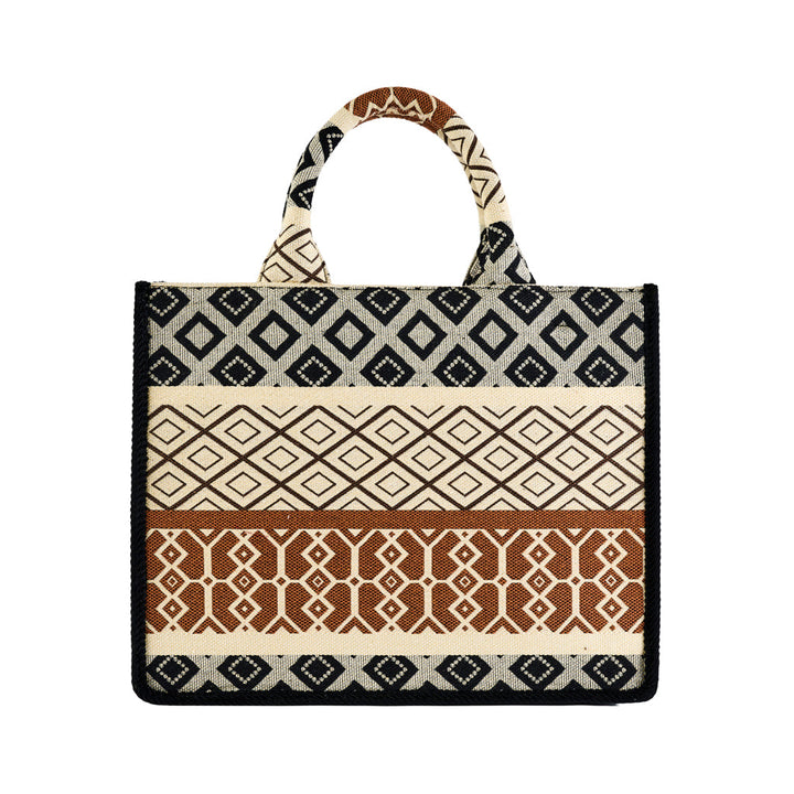 Handmade tote bag with black, brown, and beige geometric patterns