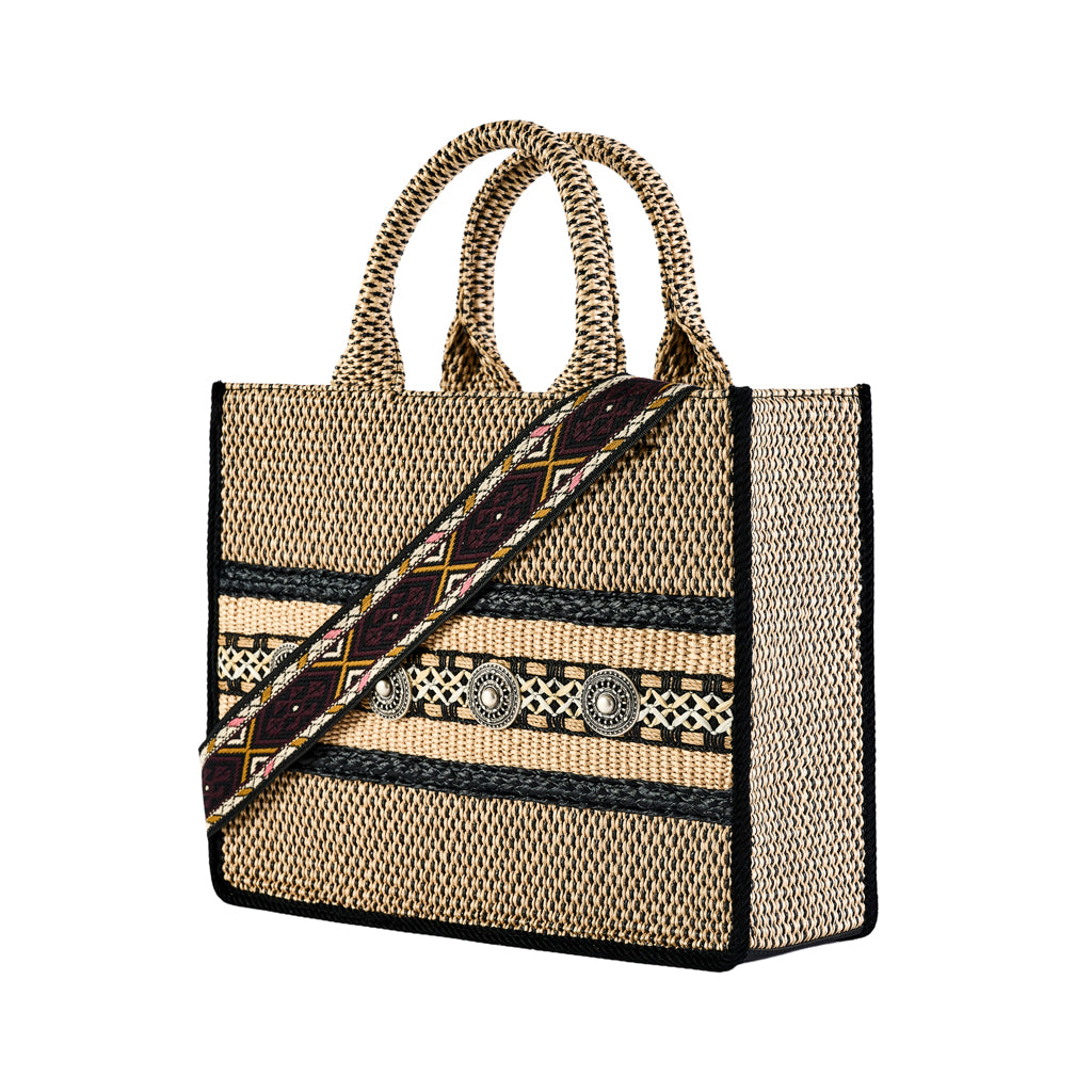 Handwoven beige and black tote bag with intricate patterns and a decorative strap