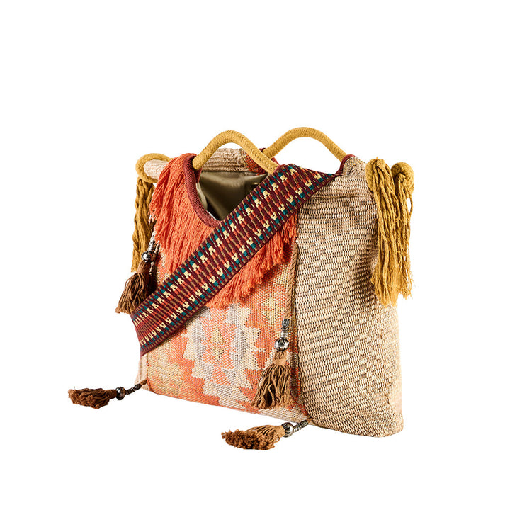 Bohemian woven handbag with colorful patterned strap and tassel details