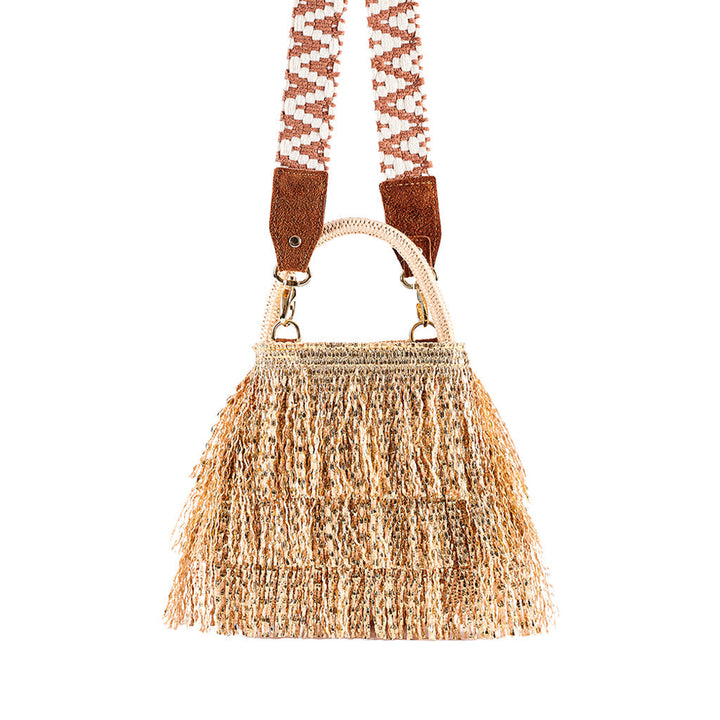 Woven straw bag with fringe and patterned shoulder strap