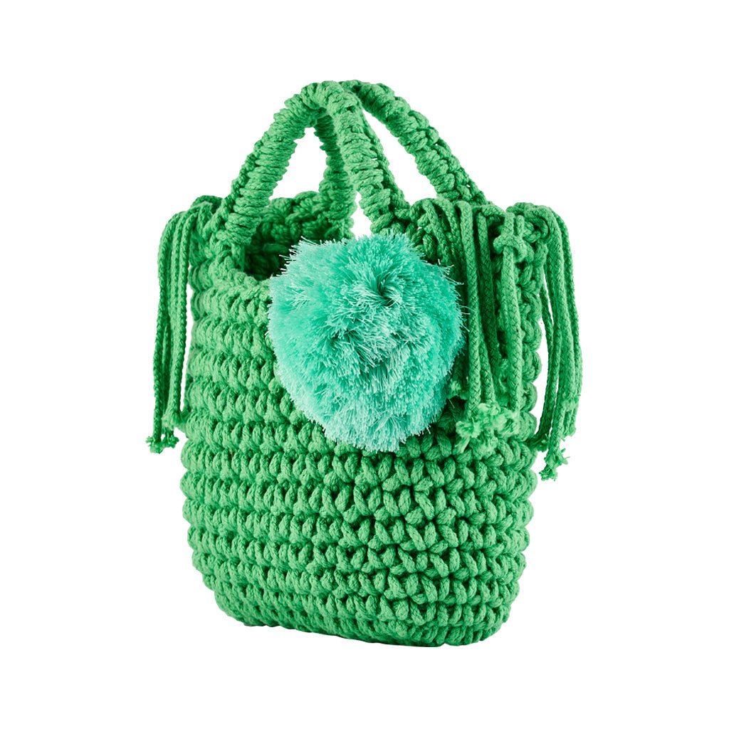 Green crochet bag with handles and a decorative pom-pom