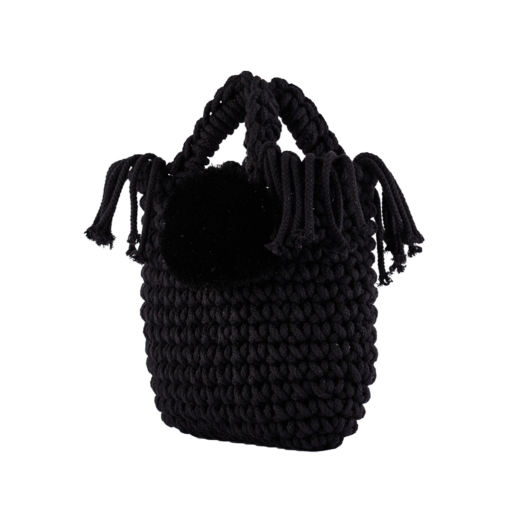 Black knitted handbag with tassel details and a decorative pompom