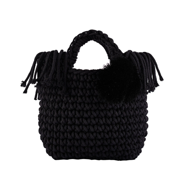 Handmade black crochet tote bag with fringe and pom-pom accents