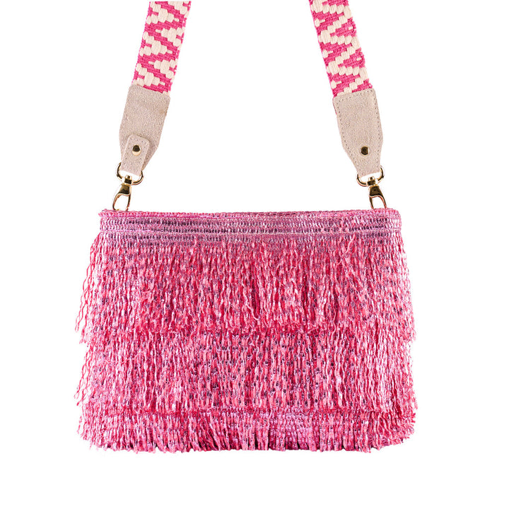 Pink fringed crossbody bag with patterned strap