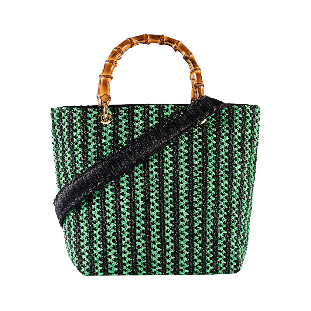 Green and black woven handbag with a bamboo handle and black shoulder strap