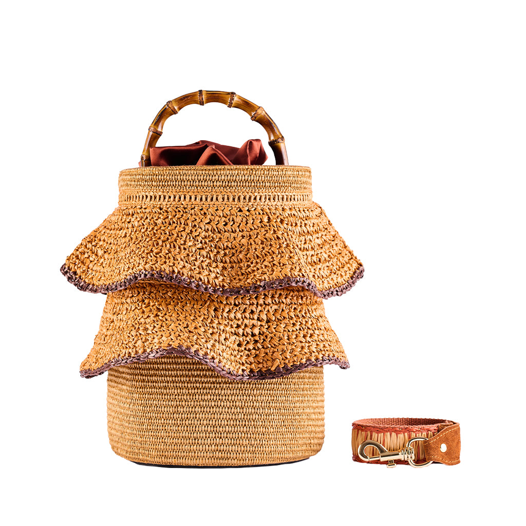 Handwoven rattan handbag with layered design and bamboo handle