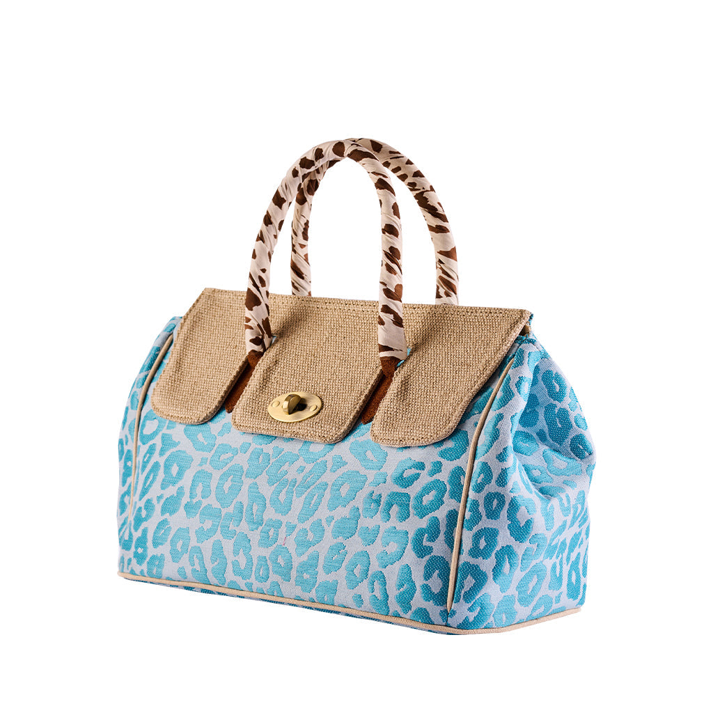 Blue leopard print handbag with brown handles and woven accents