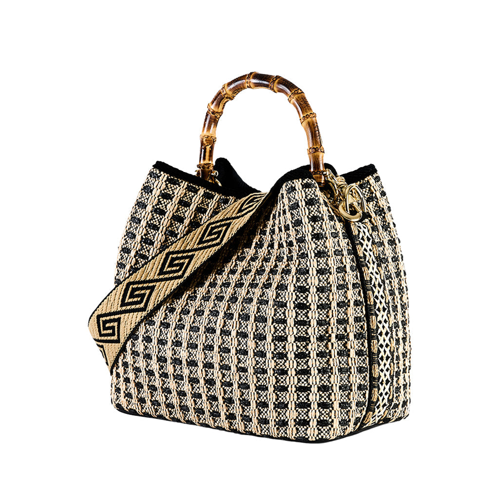 wicker handbag with bamboo handles and geometric-patterned strap