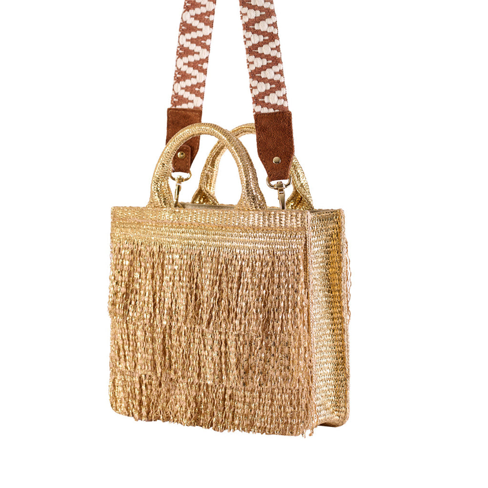 Golden fringe handbag with patterned shoulder strap