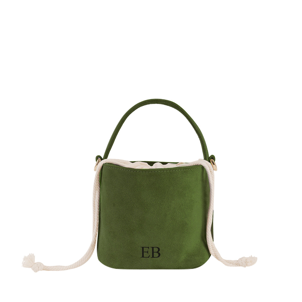 Green suede bucket bag with white drawstrings and initials EB on the front