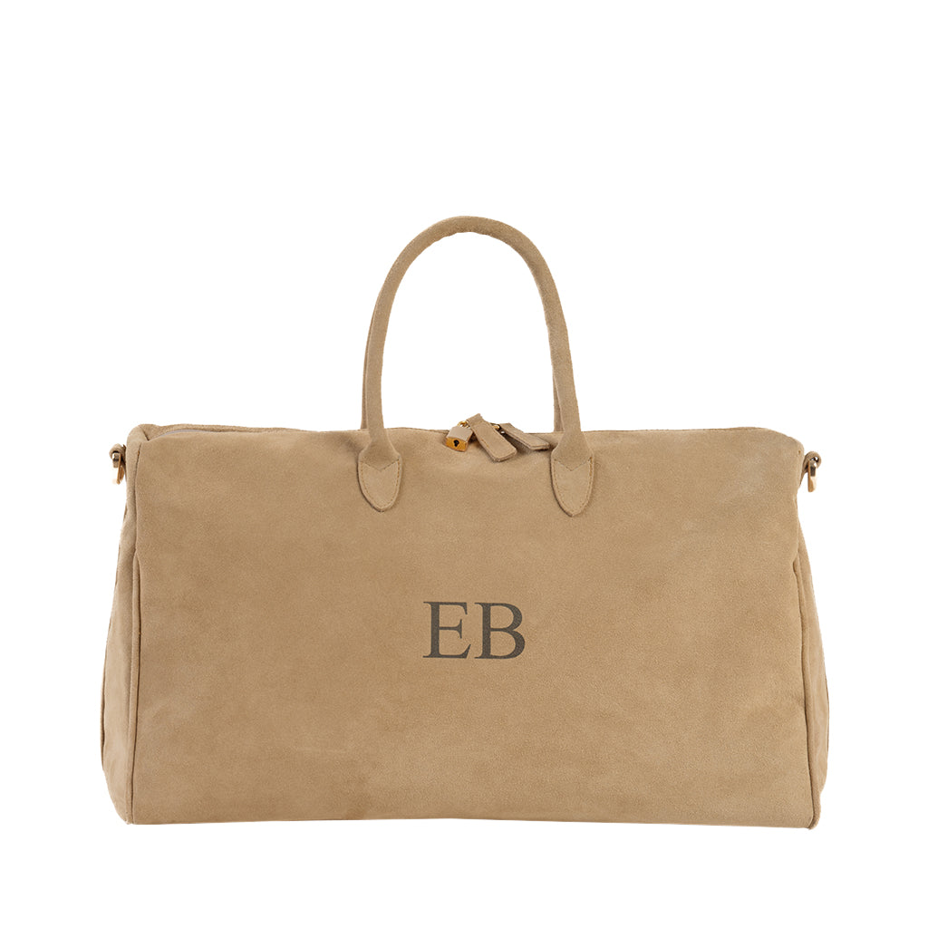 Tan suede travel bag with EB monogram and gold hardware