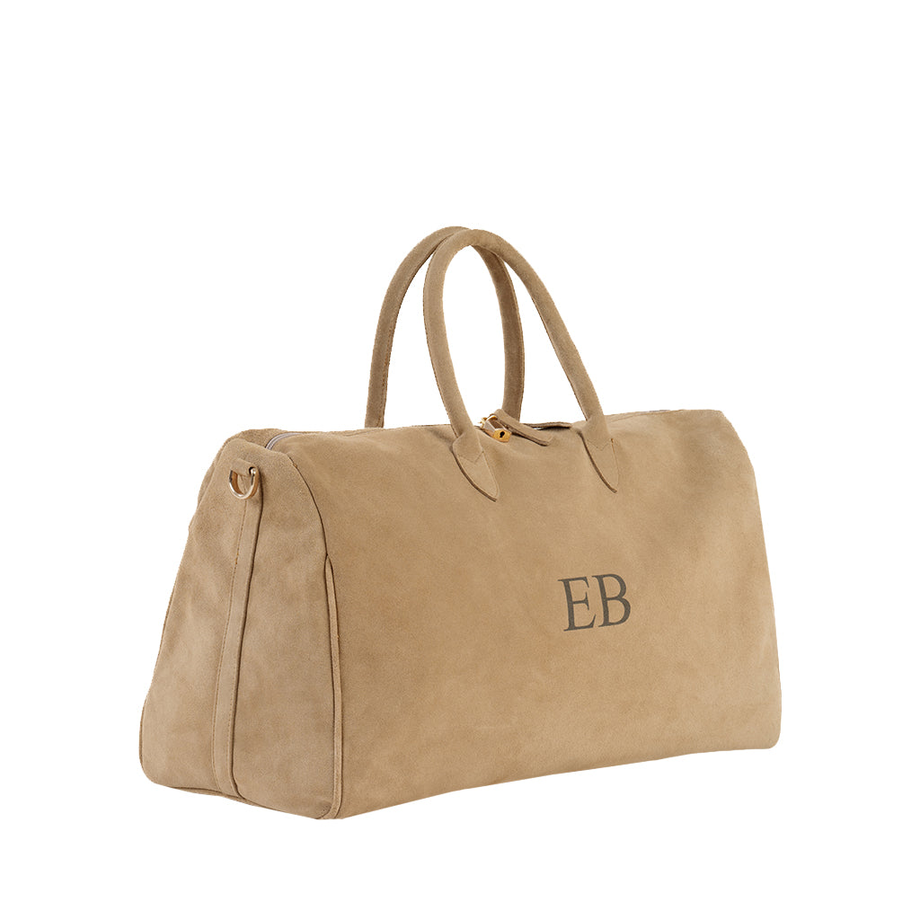 Tan suede travel bag with monogrammed 'EB' initials