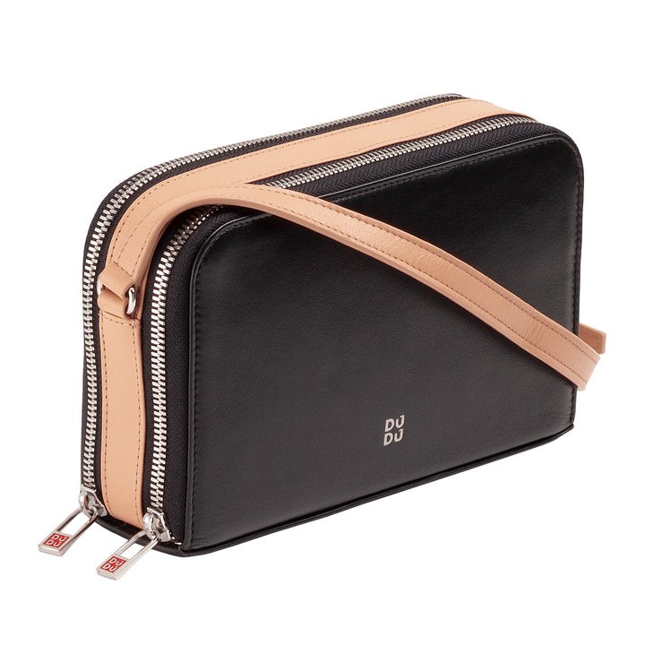 Black leather crossbody bag with tan strap and silver zippers