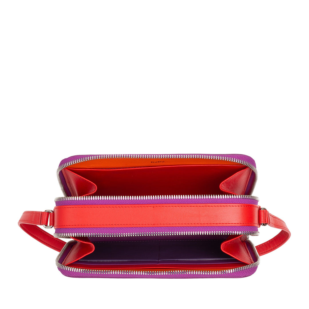Red and purple leather zippered handbag with an open view displaying its compartments