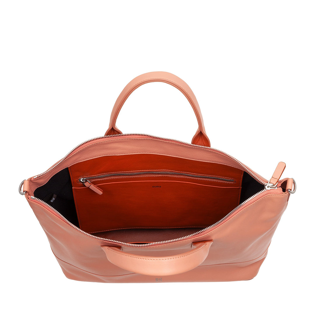 Open coral pink leather handbag with interior compartments and zipper pocket