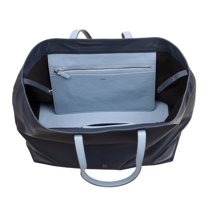 Top view of an open dark blue leather tote bag with light blue interior and zippered pocket